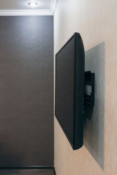 TV installed on a wall in Conifer